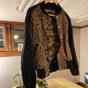 R13 bomber jacket with leopard print exterior and camouflage interior.